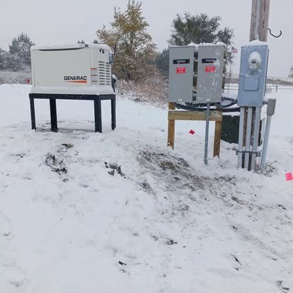 Snowy ground with a generator and electric panels